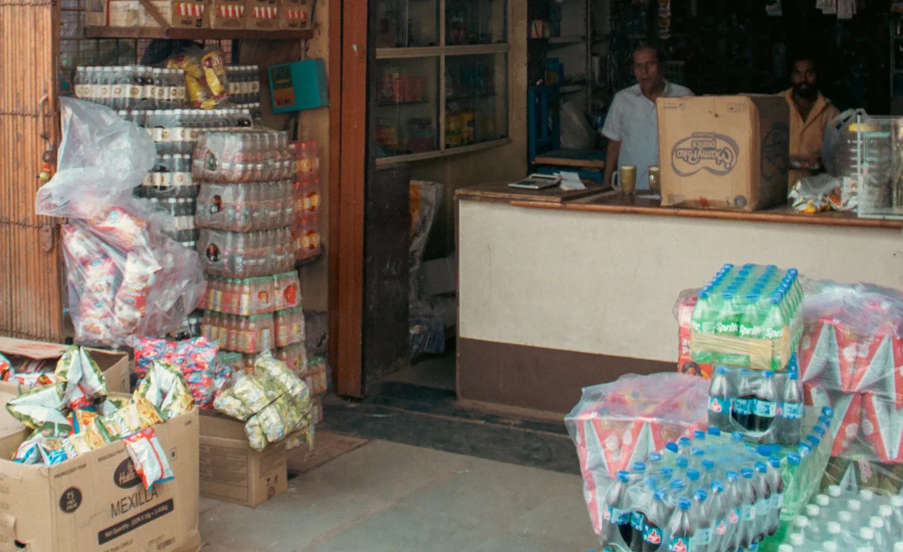 A neighbourhood store front stocked with packaged goods