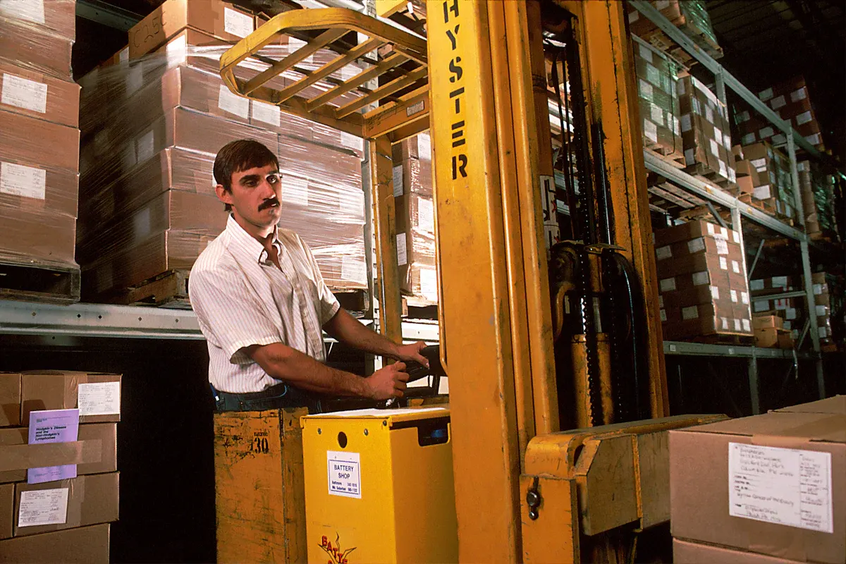 A forklift moving stock in a warehouse